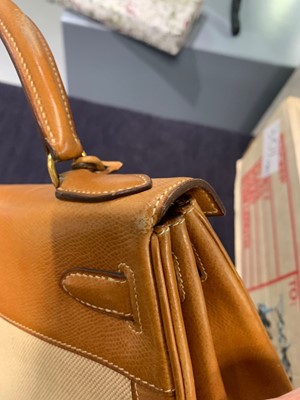 Lot 47 - An Hermès canvas and natural leather Retourné Kelly 28, 1979