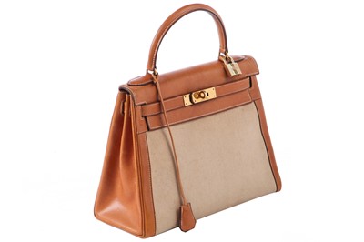 Lot 47 - An Hermès canvas and natural leather Retourné Kelly 28, 1979