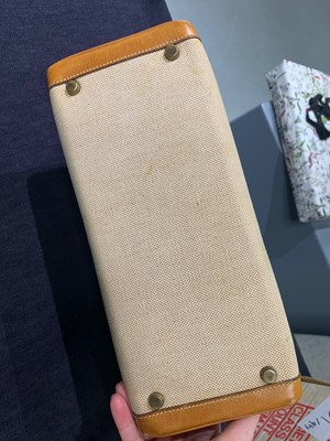 Lot 47 - An Hermès canvas and natural leather Retourné Kelly 28, 1979