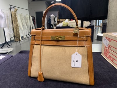 Lot 47 - An Hermès canvas and natural leather Retourné Kelly 28, 1979