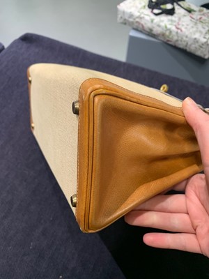 Lot 47 - An Hermès canvas and natural leather Retourné Kelly 28, 1979