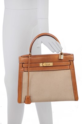 Lot 47 - An Hermès canvas and natural leather Retourné Kelly 28, 1979