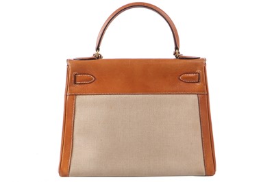 Lot 47 - An Hermès canvas and natural leather Retourné Kelly 28, 1979