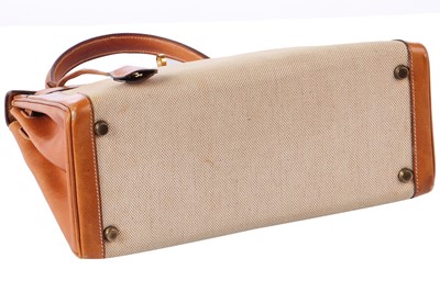 Lot 47 - An Hermès canvas and natural leather Retourné Kelly 28, 1979