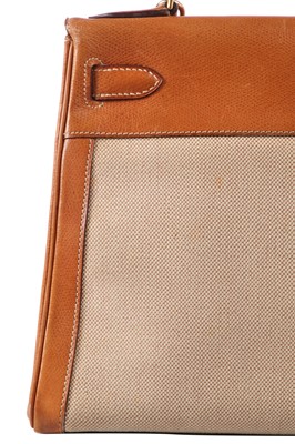 Lot 47 - An Hermès canvas and natural leather Retourné Kelly 28, 1979