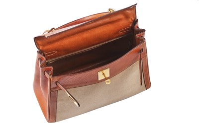 Lot 47 - An Hermès canvas and natural leather Retourné Kelly 28, 1979