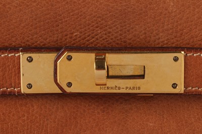 Lot 47 - An Hermès canvas and natural leather Retourné Kelly 28, 1979