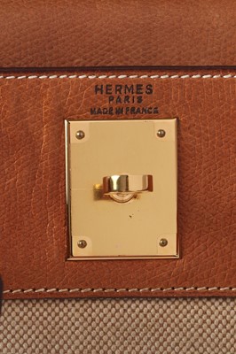Lot 47 - An Hermès canvas and natural leather Retourné Kelly 28, 1979