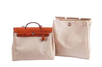 Lot 52 - An Hermès canvas and natural leather Herbag, modern