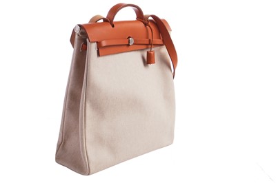 Lot 52 - An Hermès canvas and natural leather Herbag, modern