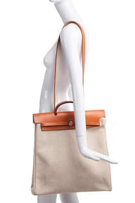 Lot 52 - An Hermès canvas and natural leather Herbag, modern