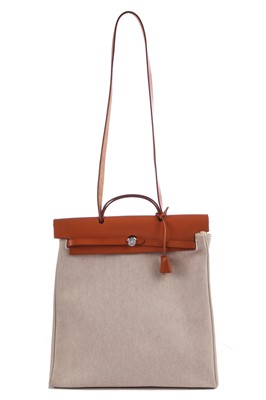 Lot 52 - An Hermès canvas and natural leather Herbag, modern