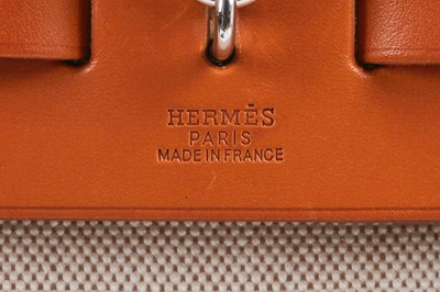 Lot 52 - An Hermès canvas and natural leather Herbag, modern