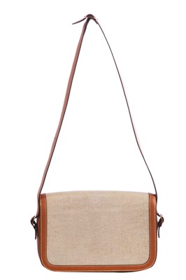 Lot 53 - An Hermès canvas and natural leather shoulder bag, 1960s