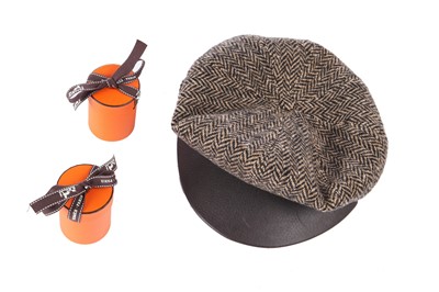 Lot 62 - An Hermès herringbone tweed flat cap, modern