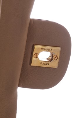 Lot 5 - A Chanel quilted beige leather classic double-flap bag, 1989-91
