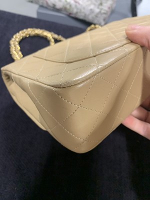 Lot 5 - A Chanel quilted beige leather classic double-flap bag, 1989-91