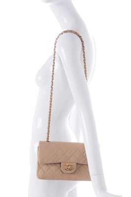 Lot 5 - A Chanel quilted beige leather classic double-flap bag, 1989-91