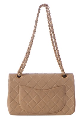 Lot 5 - A Chanel quilted beige leather classic double-flap bag, 1989-91
