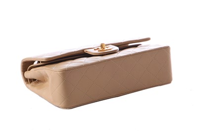 Lot 5 - A Chanel quilted beige leather classic double-flap bag, 1989-91