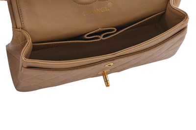 Lot 5 - A Chanel quilted beige leather classic double-flap bag, 1989-91