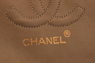 Lot 5 - A Chanel quilted beige leather classic double-flap bag, 1989-91
