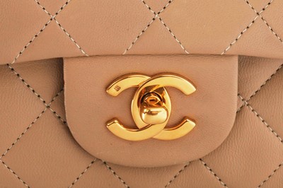 Lot 5 - A Chanel quilted beige leather classic double-flap bag, 1989-91