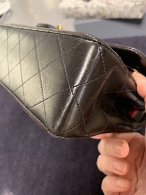 Lot 10 - A Chanel quilted black lambskin leather classic double-flap bag, 1994-96