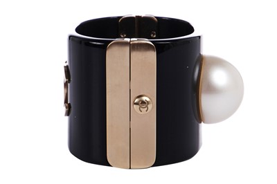 Lot 35 - A Chanel black resin cuff, Spring 2014