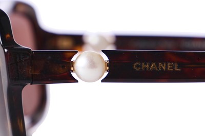 Lot 40 - Two pairs of Chanel sunglasses, 2000s