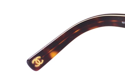 Lot 40 - Two pairs of Chanel sunglasses, 2000s