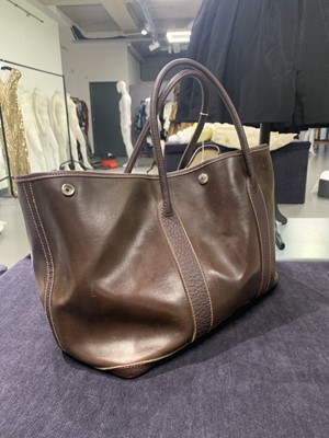 Lot 51 - An Hermès dark brown leather Garden Party Tote, modern