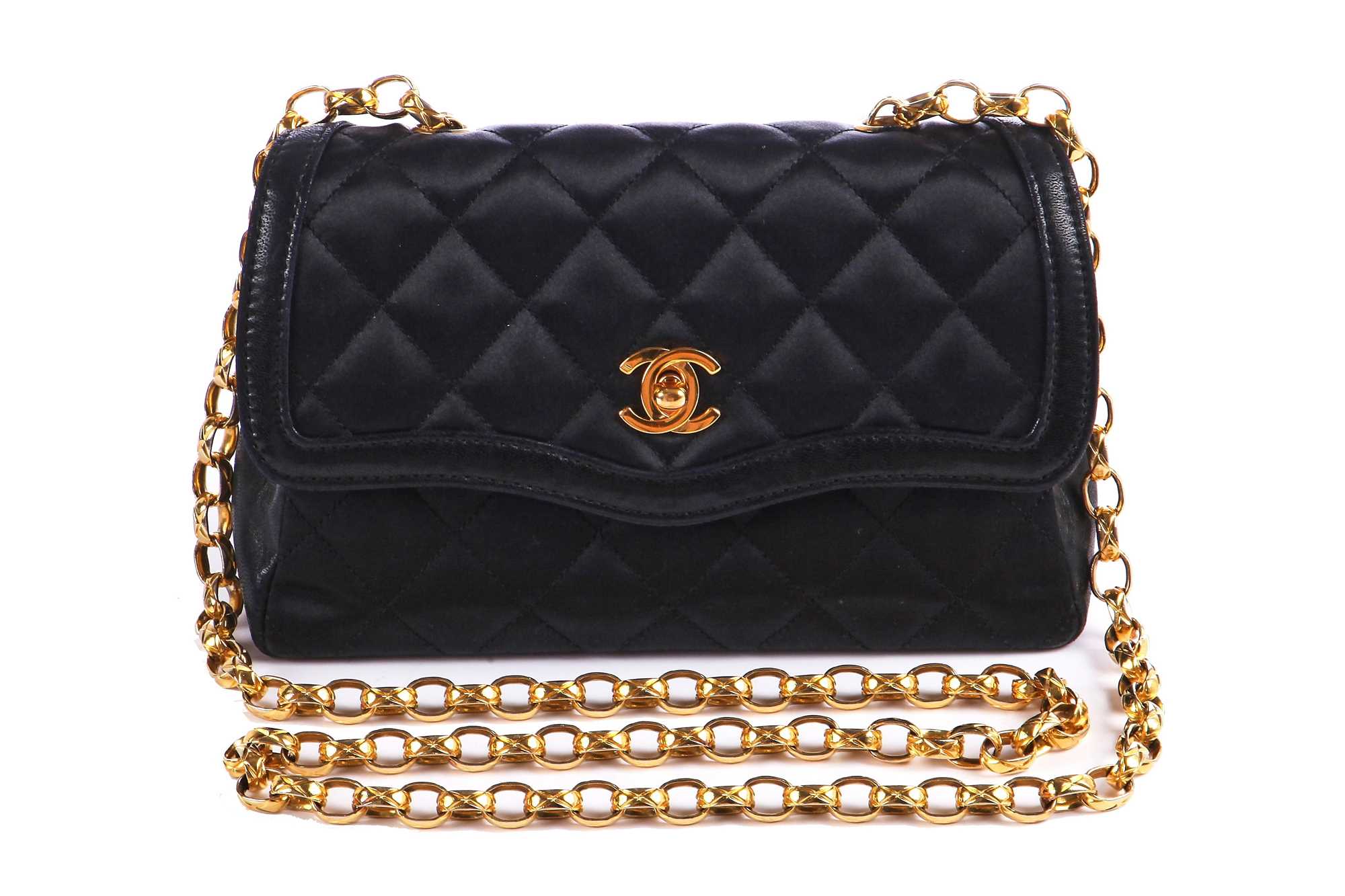 Lot 9 - A Chanel quilted black satin evening bag, 1994-96