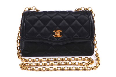 Lot 9 - A Chanel quilted black satin evening bag, 1994-96