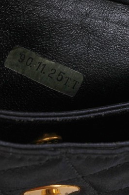 Lot 9 - A Chanel quilted black satin evening bag, 1994-96