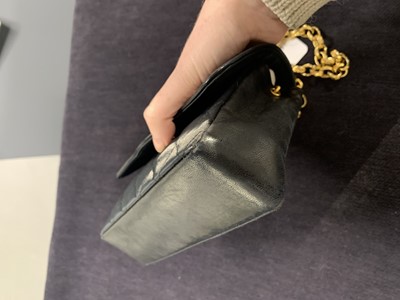 Lot 9 - A Chanel quilted black satin evening bag, 1994-96
