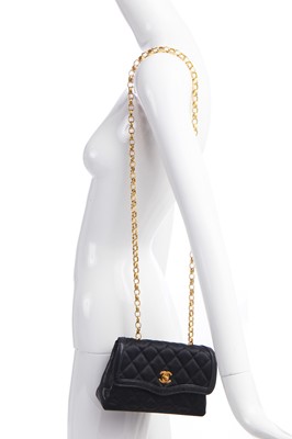 Lot 9 - A Chanel quilted black satin evening bag, 1994-96