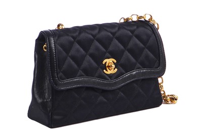 Lot 9 - A Chanel quilted black satin evening bag, 1994-96
