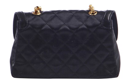 Lot 9 - A Chanel quilted black satin evening bag, 1994-96
