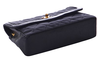 Lot 9 - A Chanel quilted black satin evening bag, 1994-96