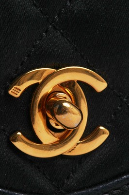 Lot 9 - A Chanel quilted black satin evening bag, 1994-96