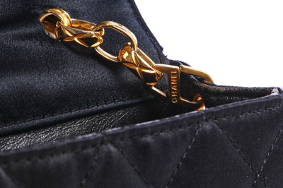 Lot 9 - A Chanel quilted black satin evening bag, 1994-96