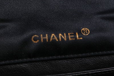 Lot 9 - A Chanel quilted black satin evening bag, 1994-96