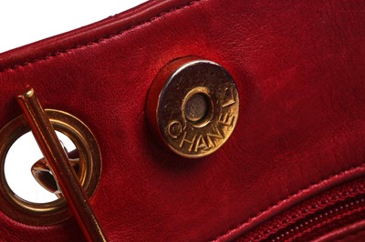 Lot 3 - A Chanel quilted red lambskin leather Chandra bag, 1980s