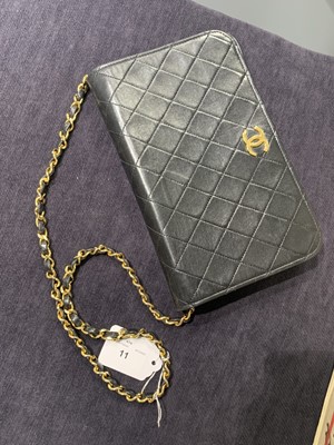 Lot 11 - A Chanel quilted black leather flap bag, probably mid-1990s
