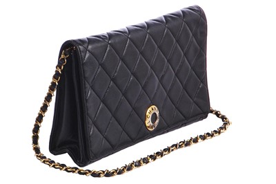 Lot 7 - A Chanel quilted black leather flap bag, 1980s