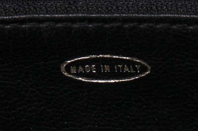 Lot 7 - A Chanel quilted black leather flap bag, 1980s
