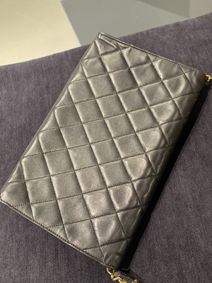 Lot 7 - A Chanel quilted black leather flap bag, 1980s