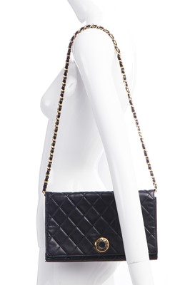 Lot 7 - A Chanel quilted black leather flap bag, 1980s