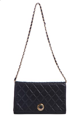 Lot 7 - A Chanel quilted black leather flap bag, 1980s